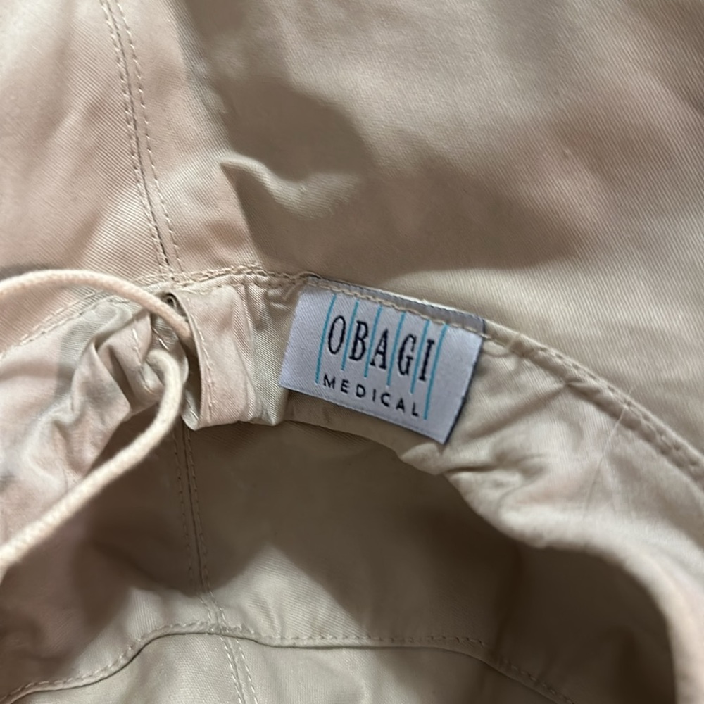 Cream colored rain bucket hat Obagi medical - Picture 7 of 8